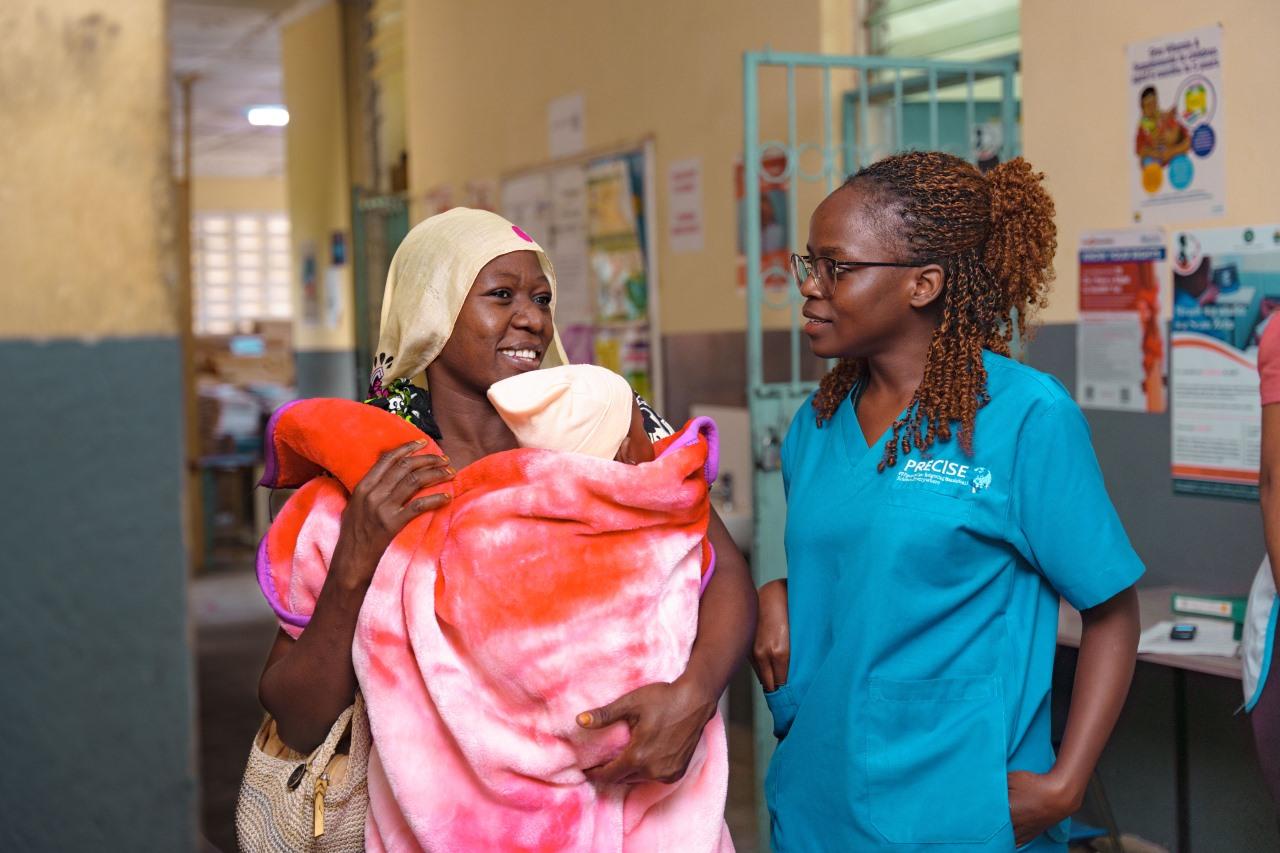Sonographer Stacy Otieno (right) and a patient.