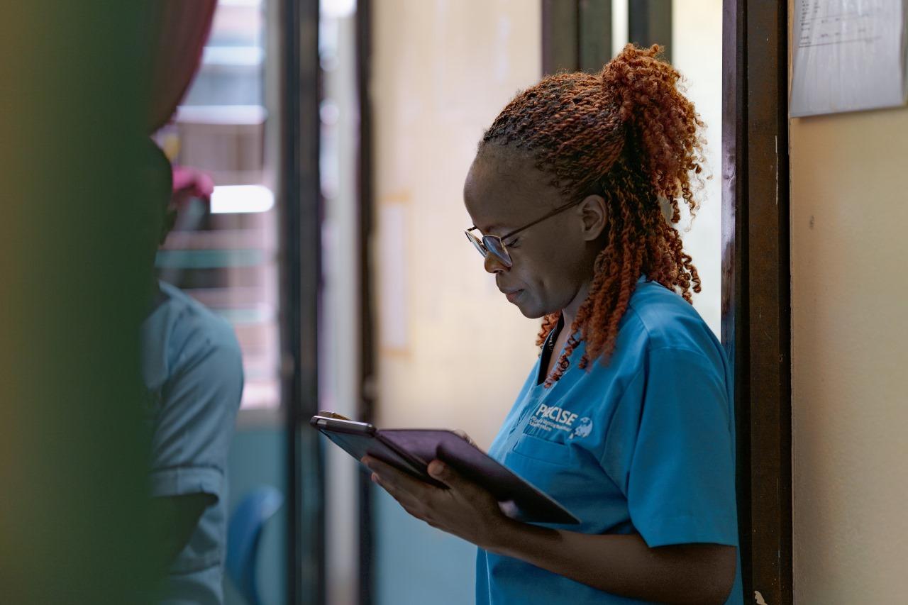 Radiographer Stacy Otieno working on her Tablet at Kilifi County’s Rabai Sub-County Hospital, Kenya.