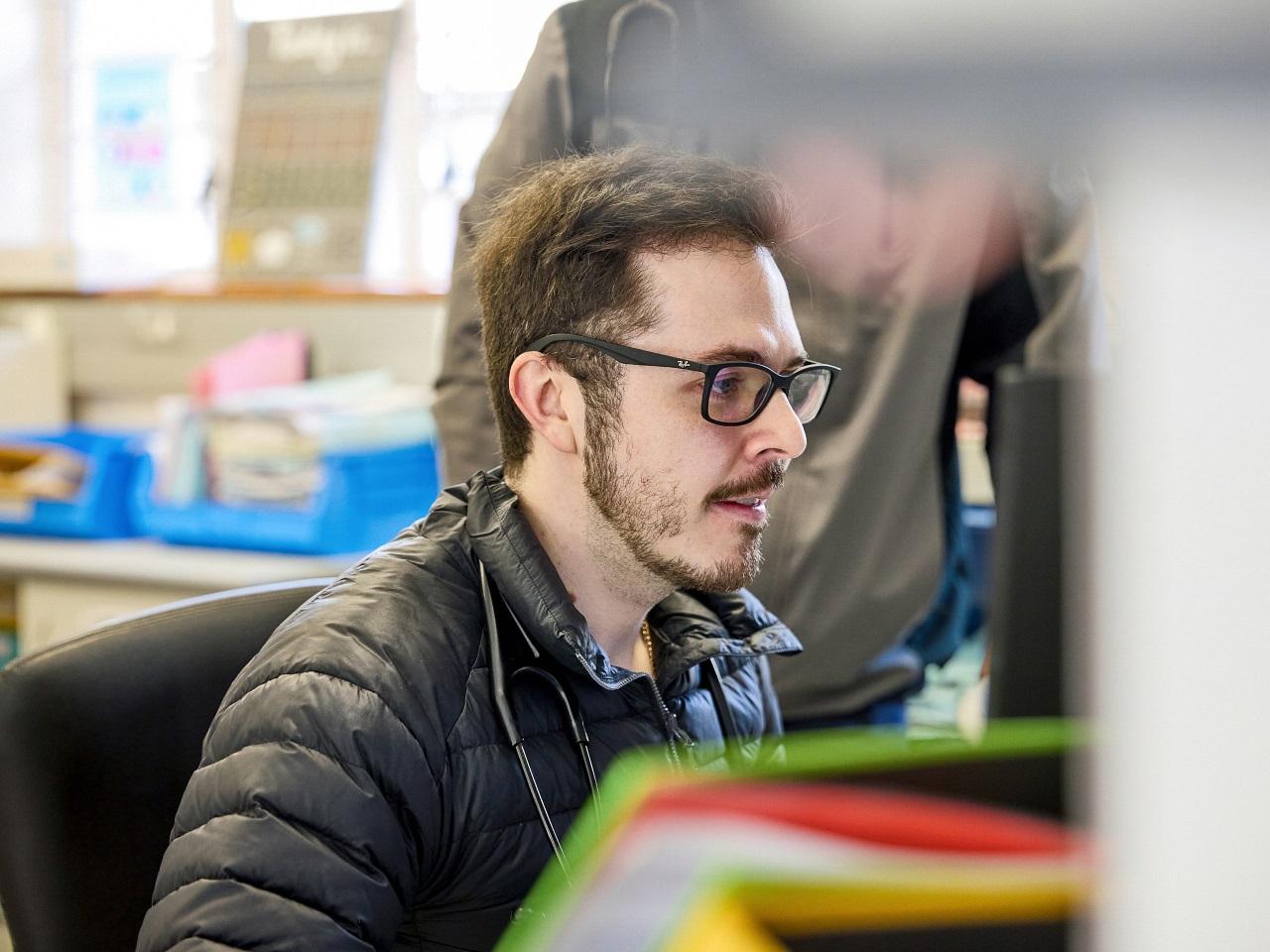 Jonathan Spanos, medical officer from George in SA is looking at a screen in full concentration.