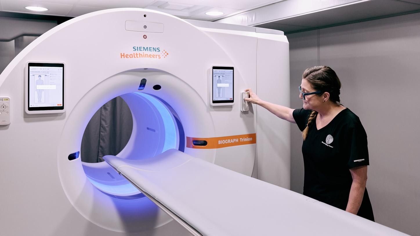Harrell adjusts the mood lighting. Color options for patients include white, orange, cyan, blue, pink, green, and yellow.