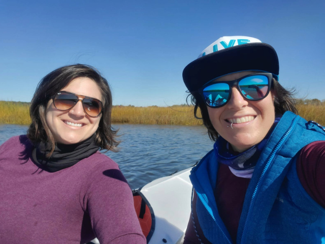 Two women on a boat on a lake